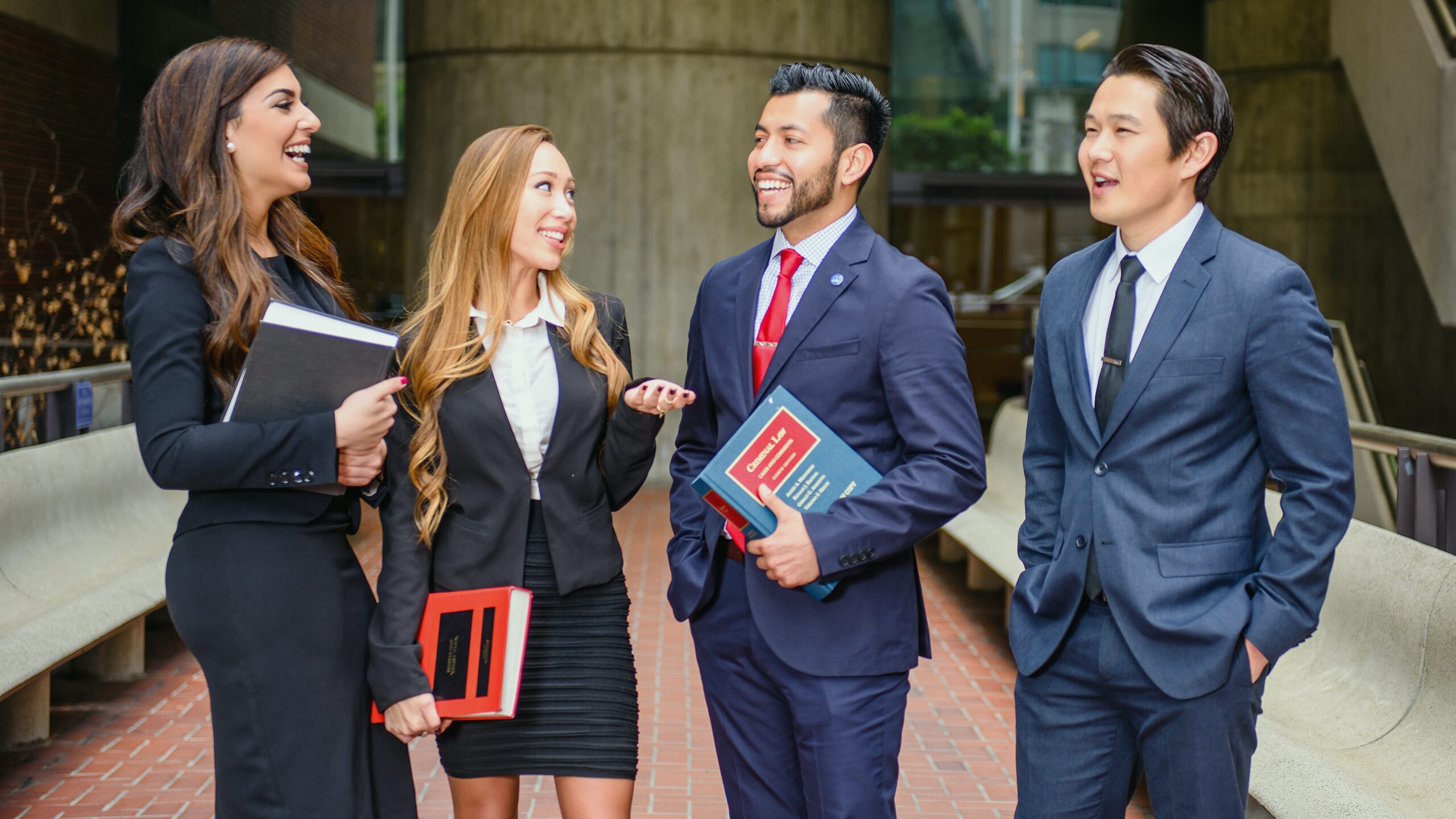 Students talking in front of the Golden Gate University building.