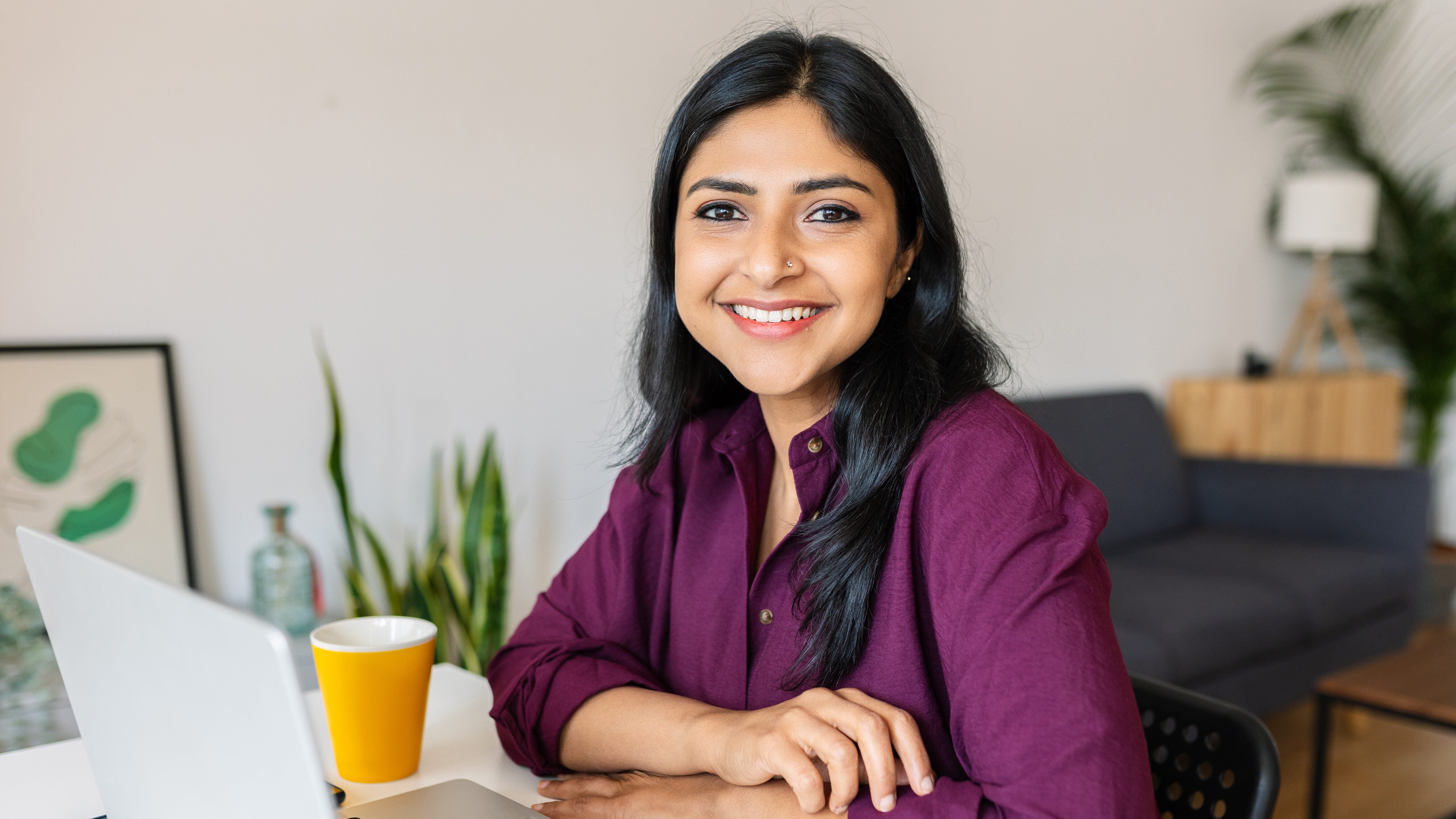 Woman working from home on laptop.